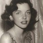 Vintage portrait of a woman in a patterned dress.