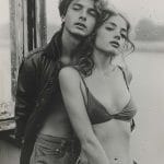 Stylish young couple posing together near window.