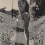 Black and white photo of woman in nature.