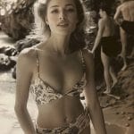 Woman in floral bikini on sunny beach