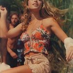 Woman in floral top relaxing outdoors