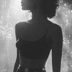 Silhouette of woman in artistic lighting.