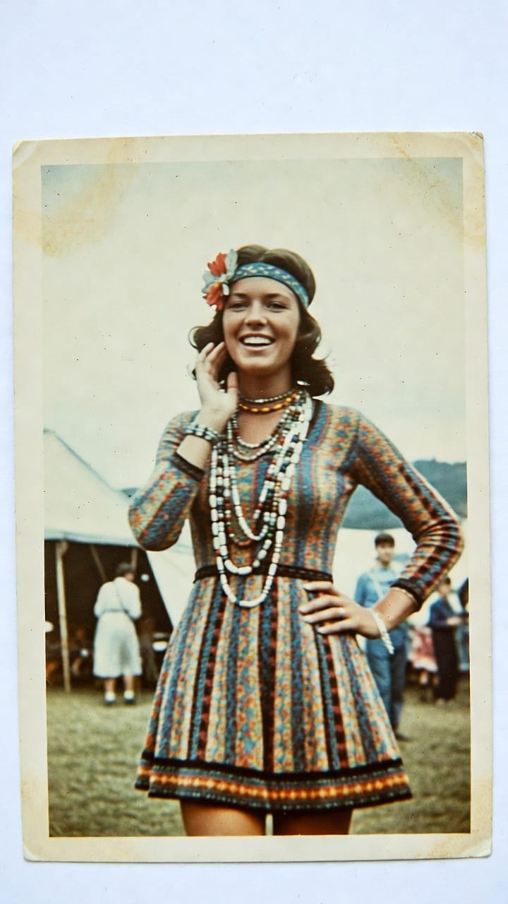 Smiling woman in colorful dress at festival