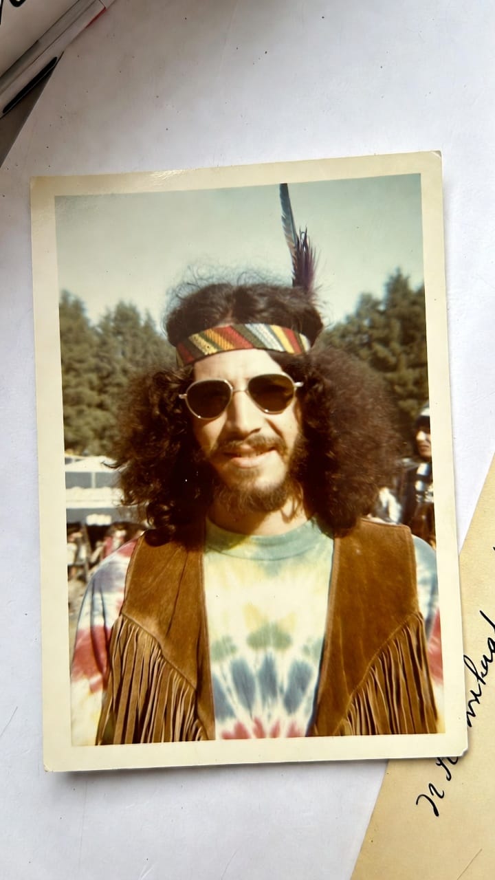 Vintage photo of man in 1970s hippie attire