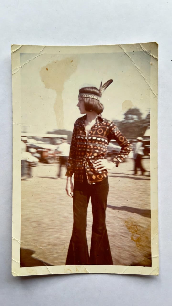 Vintage photo of woman in flared pants outdoors