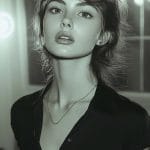 Woman in black shirt with blurred lights background