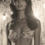 Vintage-style portrait under straw canopy