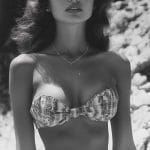 Vintage portrait of woman in plaid bikini and skirt.