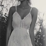 Woman in white lace dress outdoors