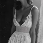 Black and white photo of woman in dress