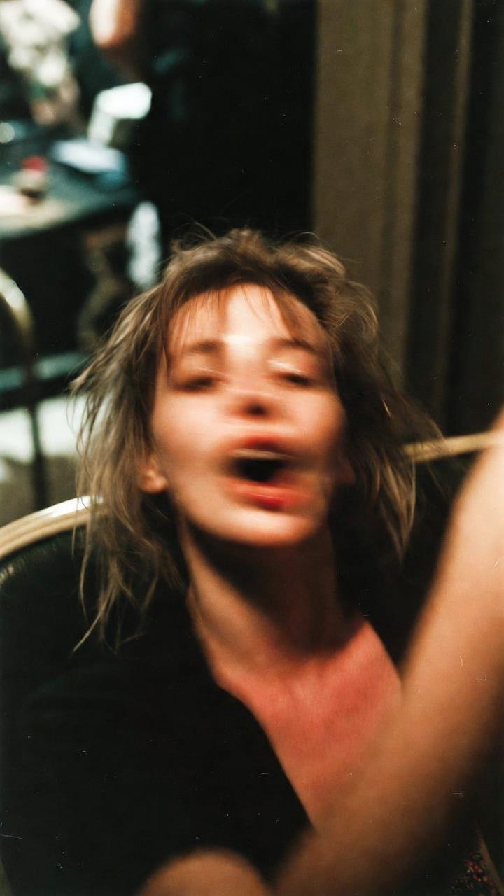 Blurred motion portrait of woman with tousled hair