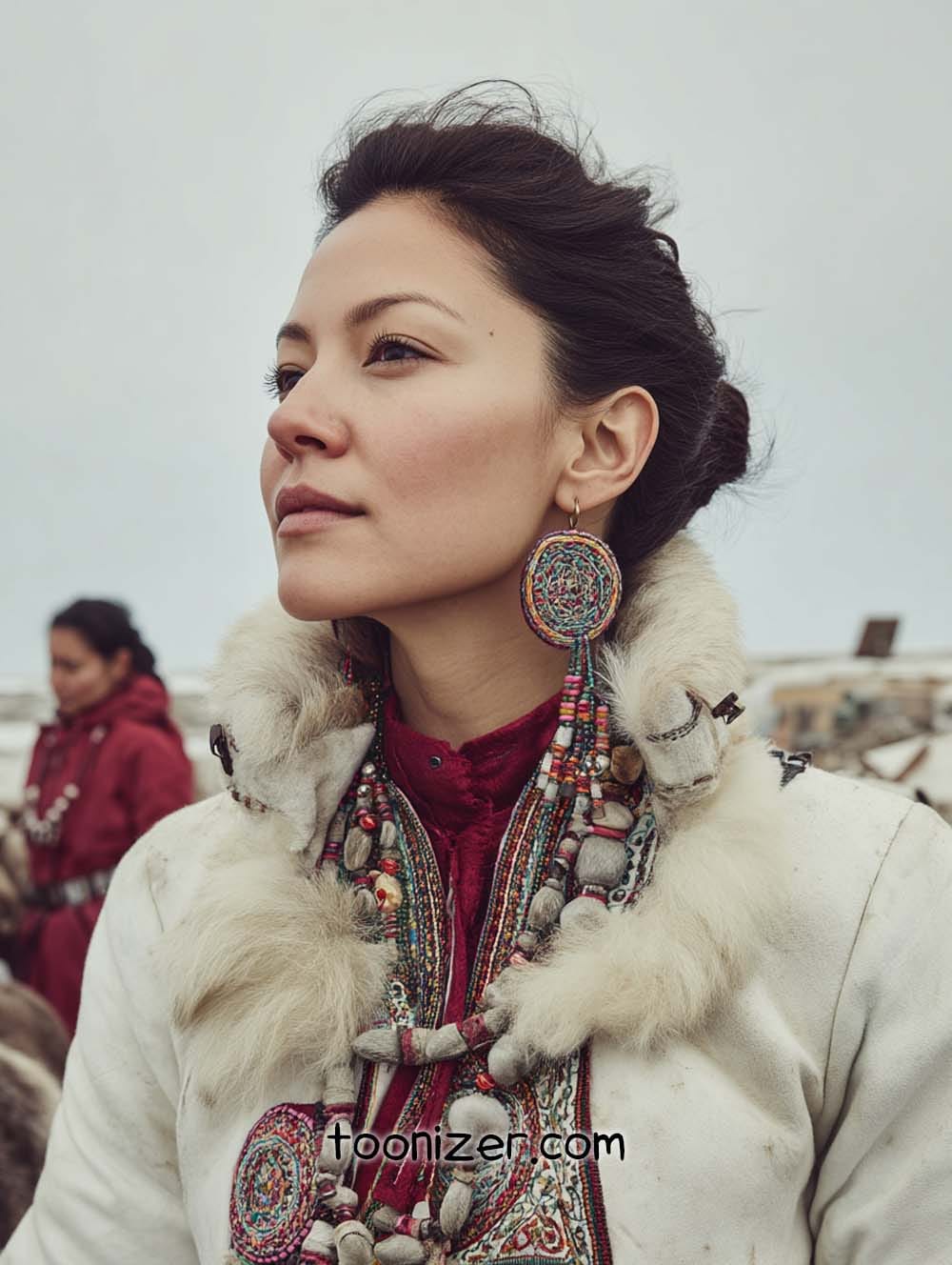 Person in traditional attire with intricate jewelry.