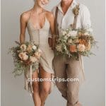 Smiling couple holding flower bouquets
