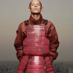 Person wearing vibrant red armor.