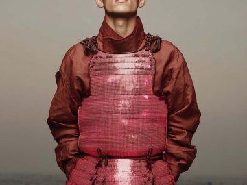 Person wearing vibrant red armor.