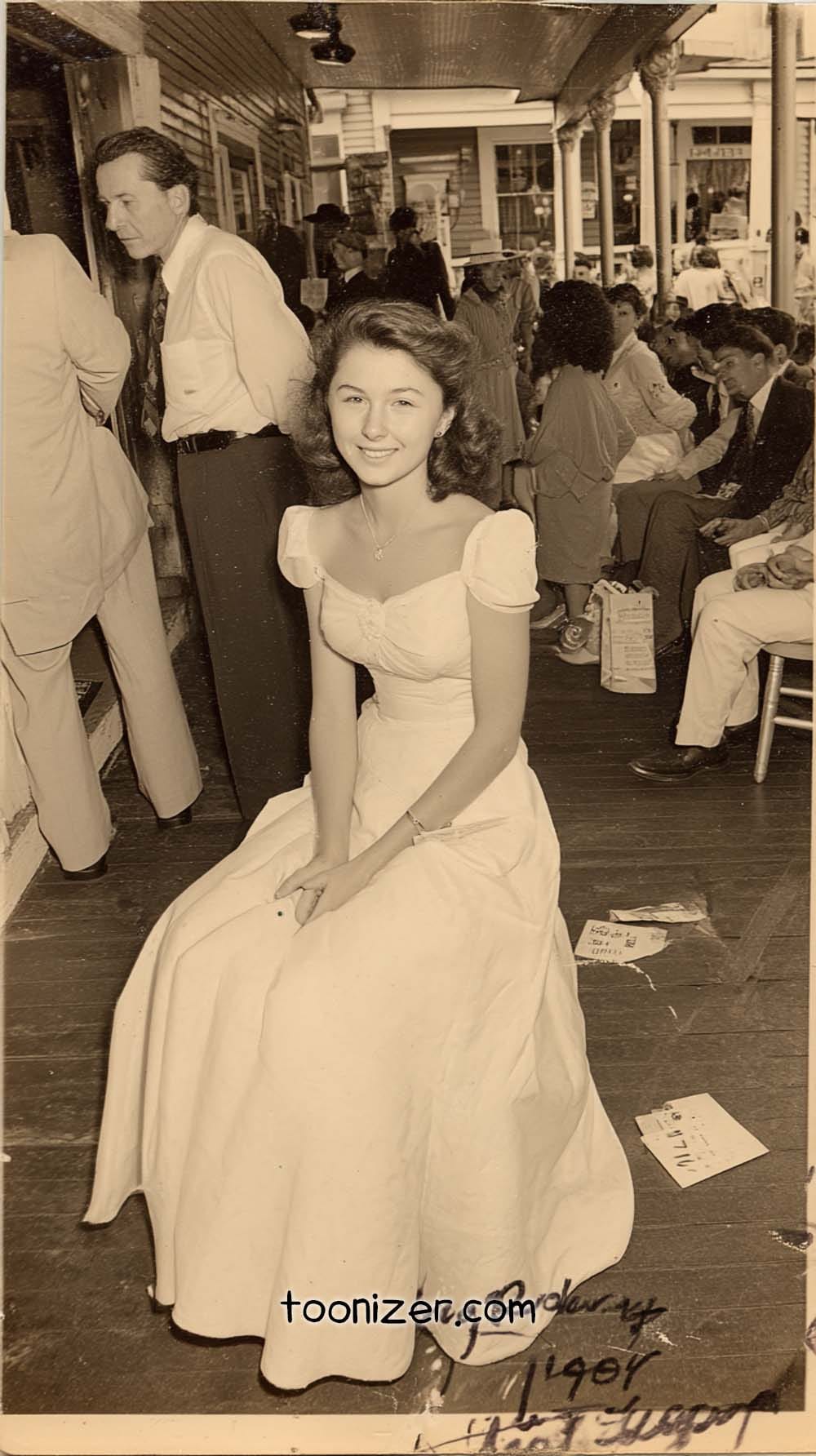 Smiling woman in vintage dress on porch