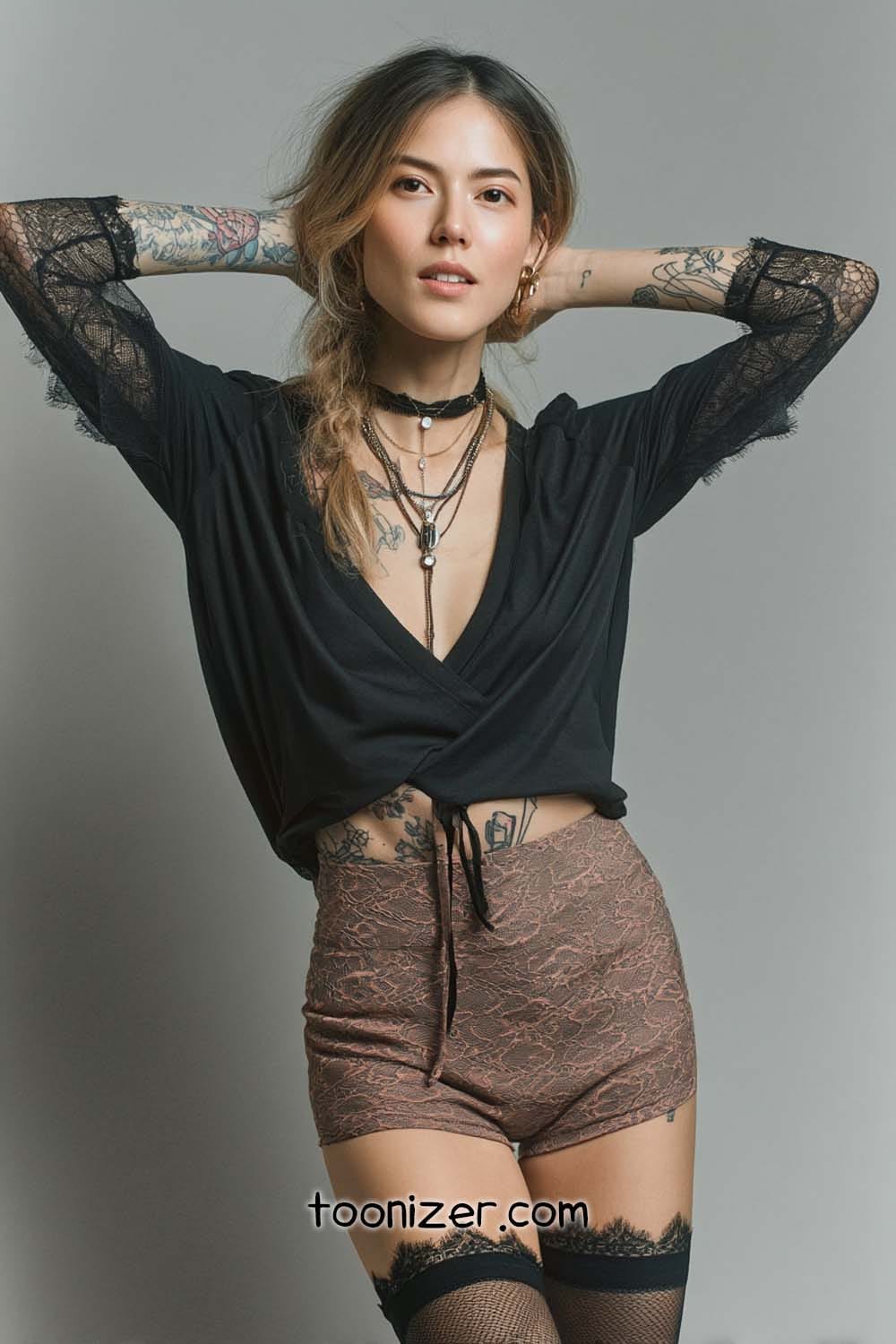 Stylish woman in lace shorts and black top.