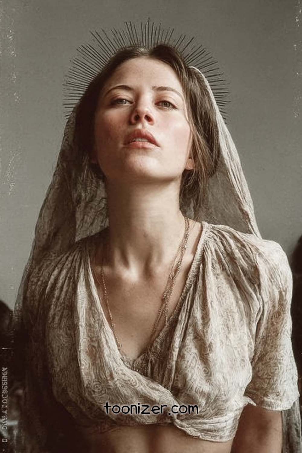 Woman with halo-inspired headdress and veil.