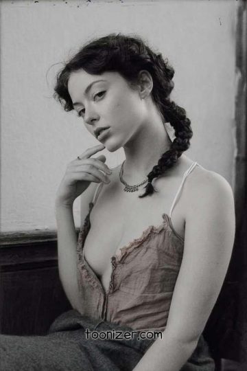 Woman with braided hair in vintage style.