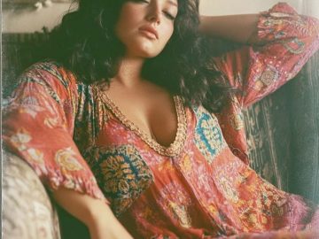 Woman relaxing in colorful bohemian dress