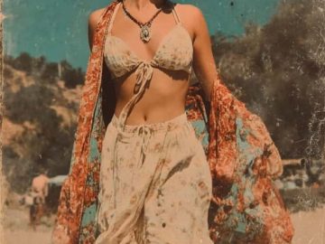 Stylish woman in boho outdoor setting