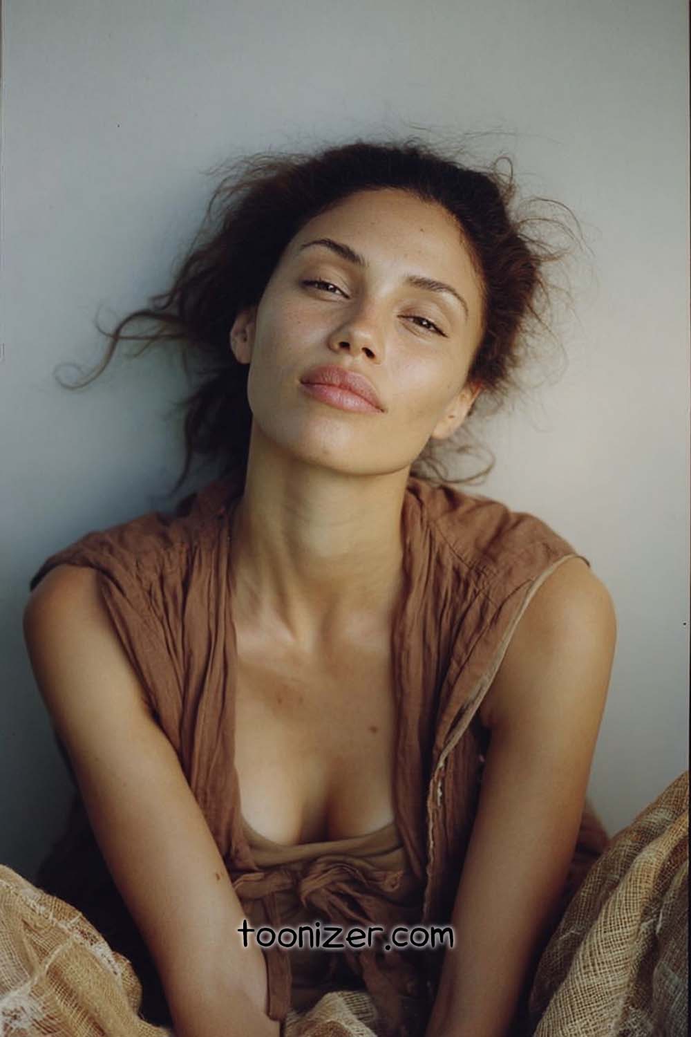 Person with relaxed expression and messy hair
