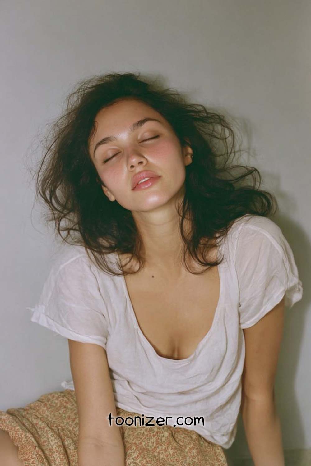 Woman with closed eyes in casual outfit.