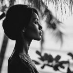 Profile portrait of woman in nature, black and white.