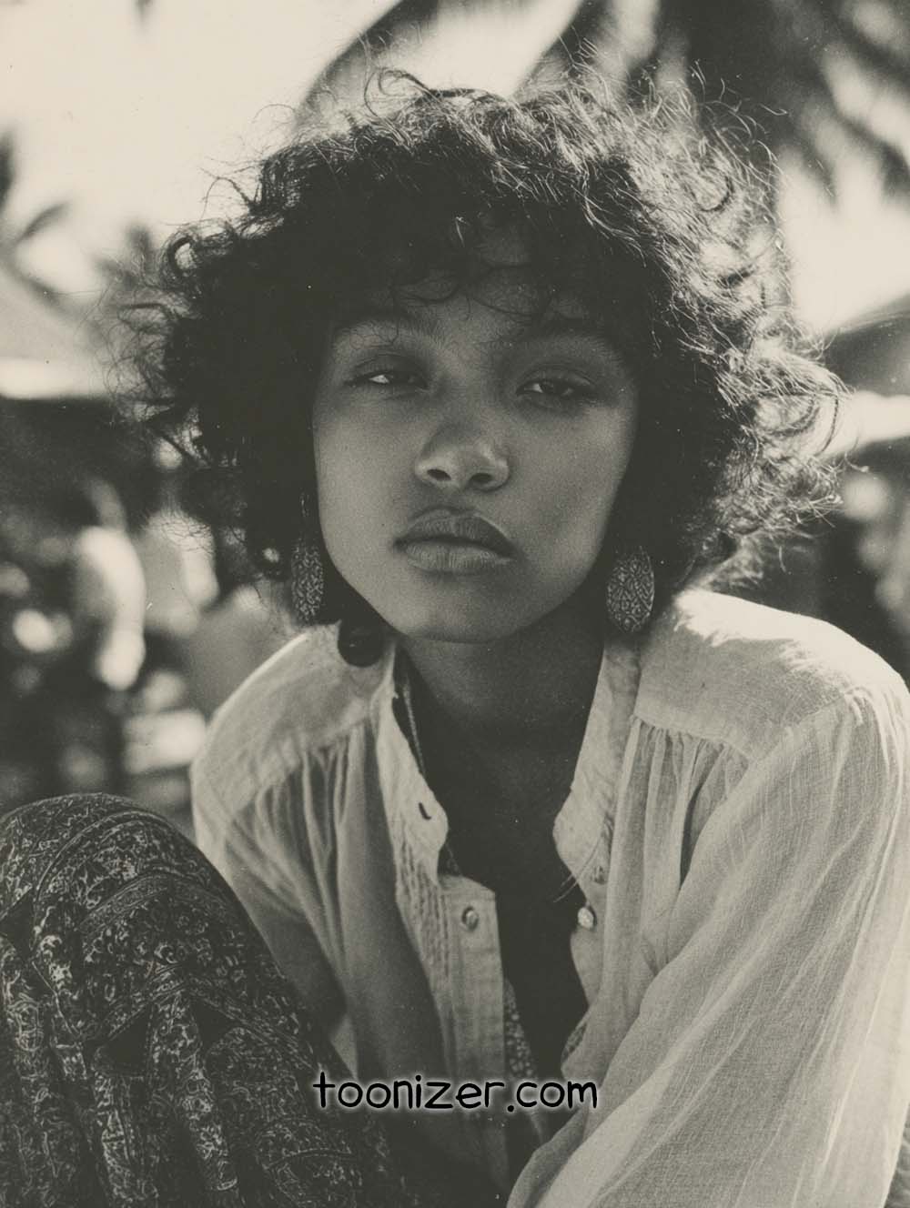 Woman outside in tropical environment, black and white photo.