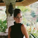 Woman in resort setting with gardens