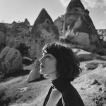 Woman in rocky landscape, black and white photo