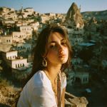 Woman posing in Cappadocia landscape setting.