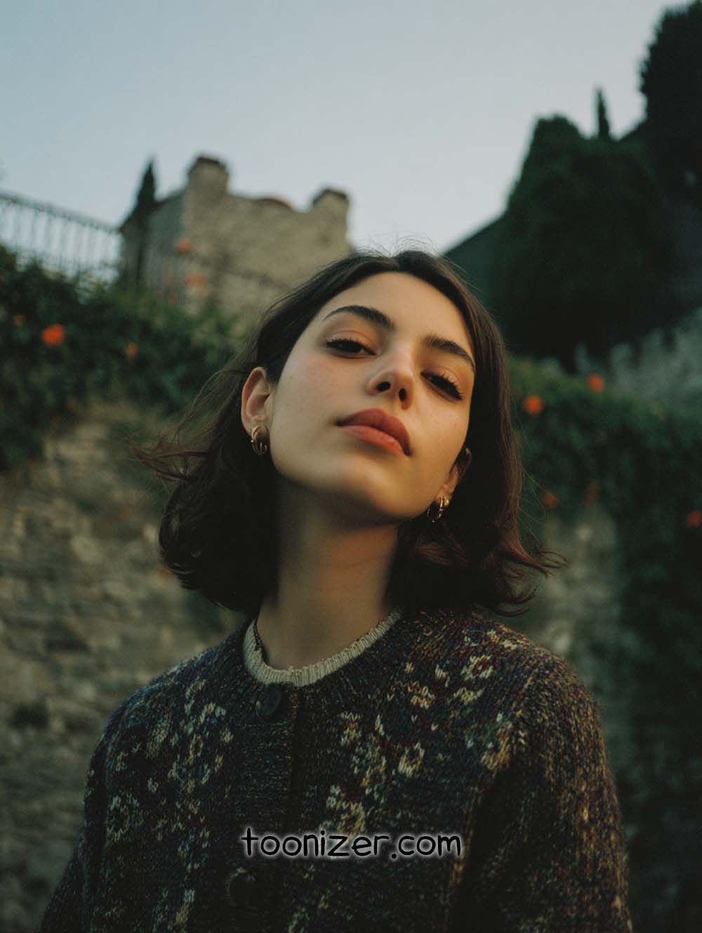 Woman poses confidently outdoors, ancient stone wall background.