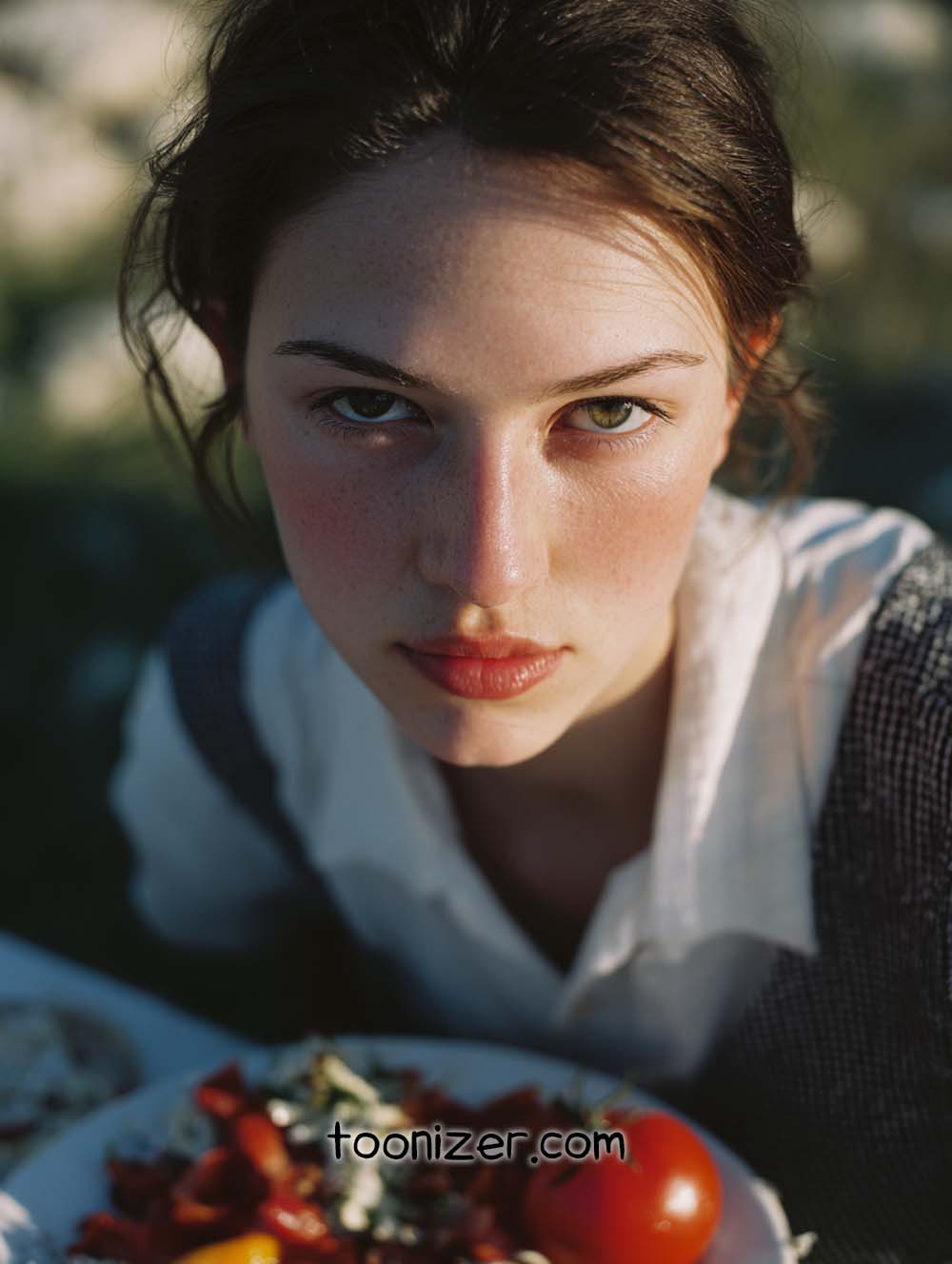 Person with salad and outdoor setting