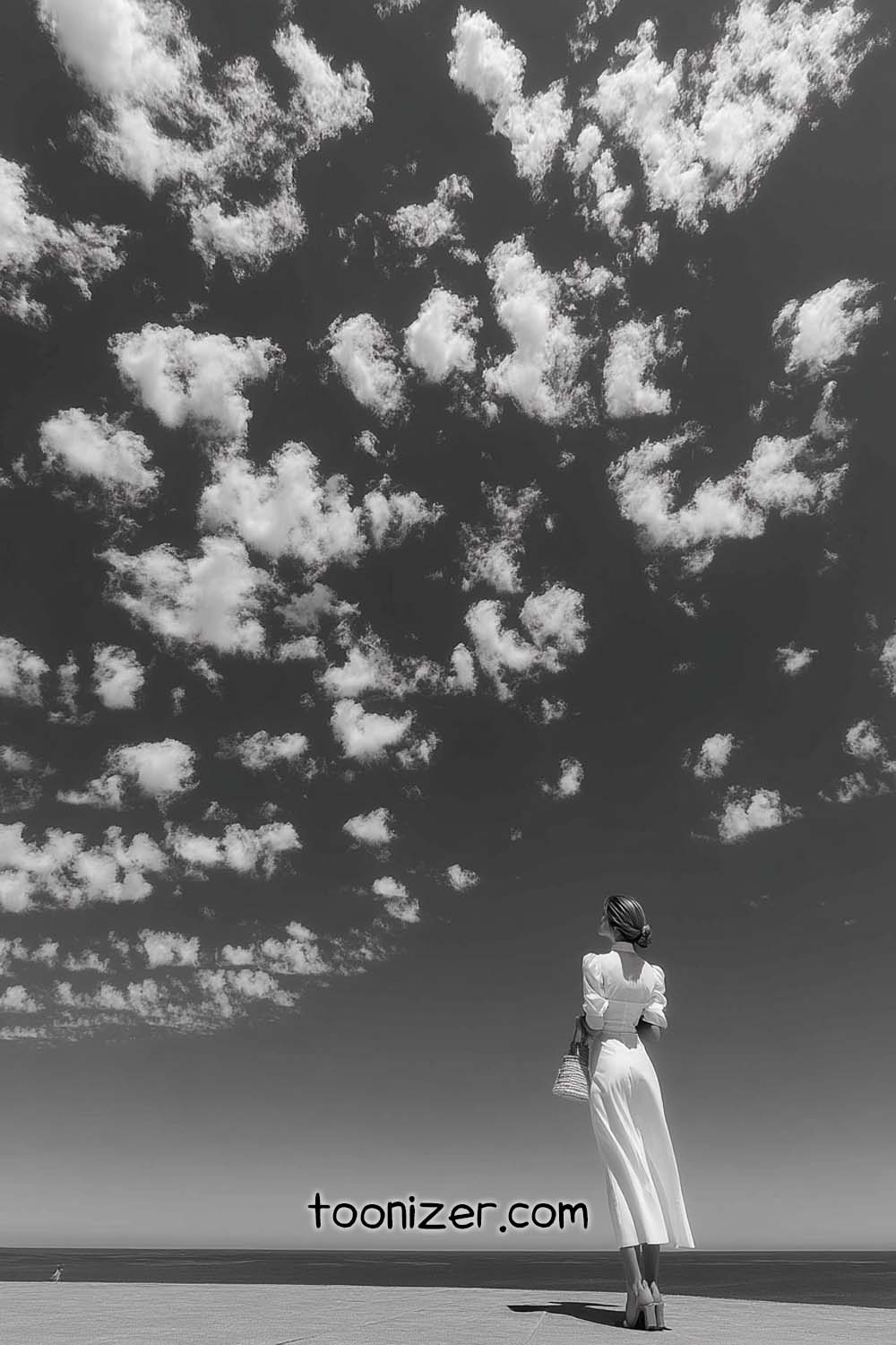 Woman in white dress under cloudy sky
