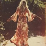 Woman in vintage dress walking in sunlight