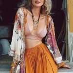 Woman in bohemian outfit with floral shawl