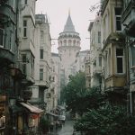 Galata Tower framed by rainy street view