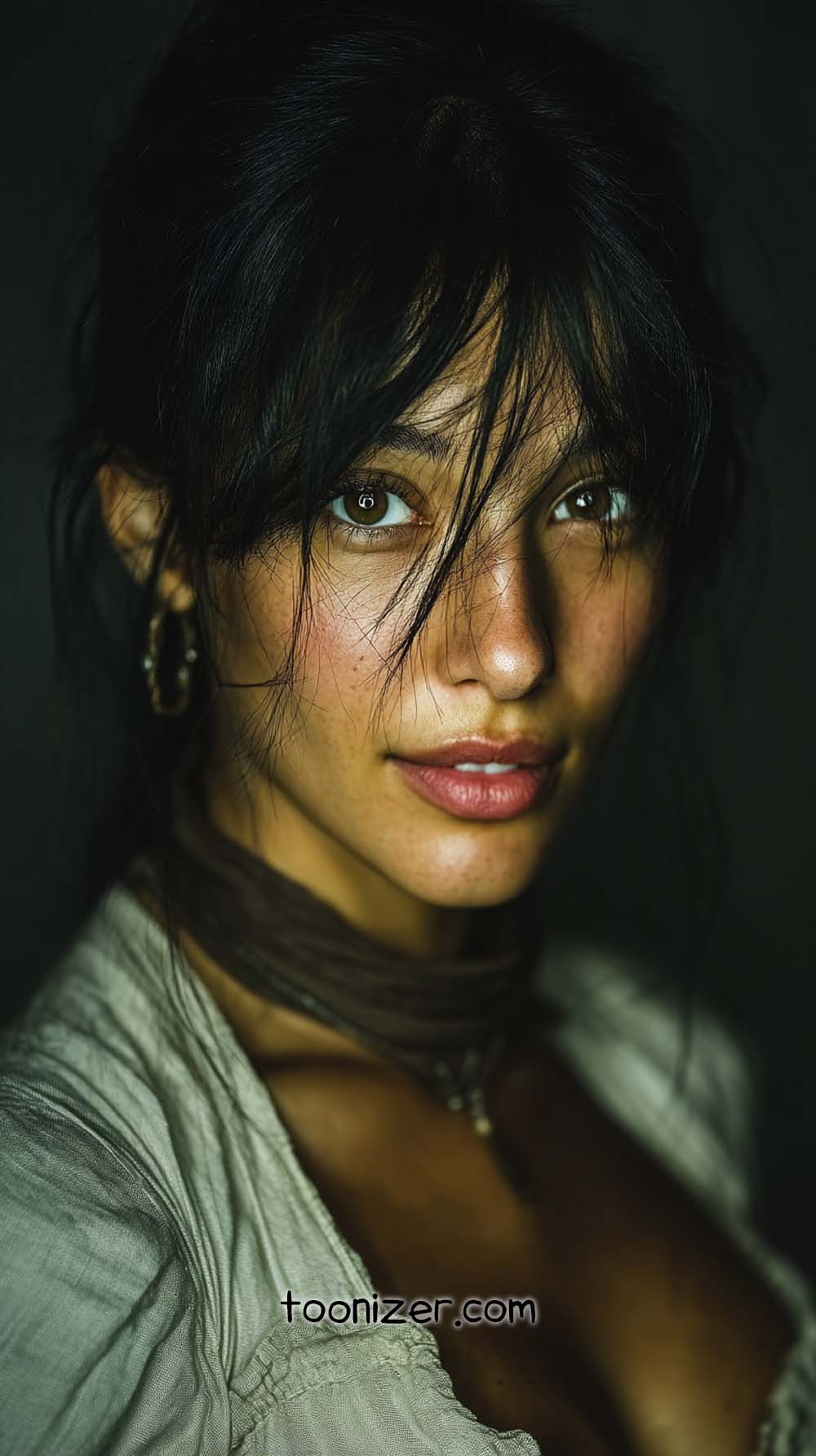 Woman with dark hair, soft lighting, emotional expression.
