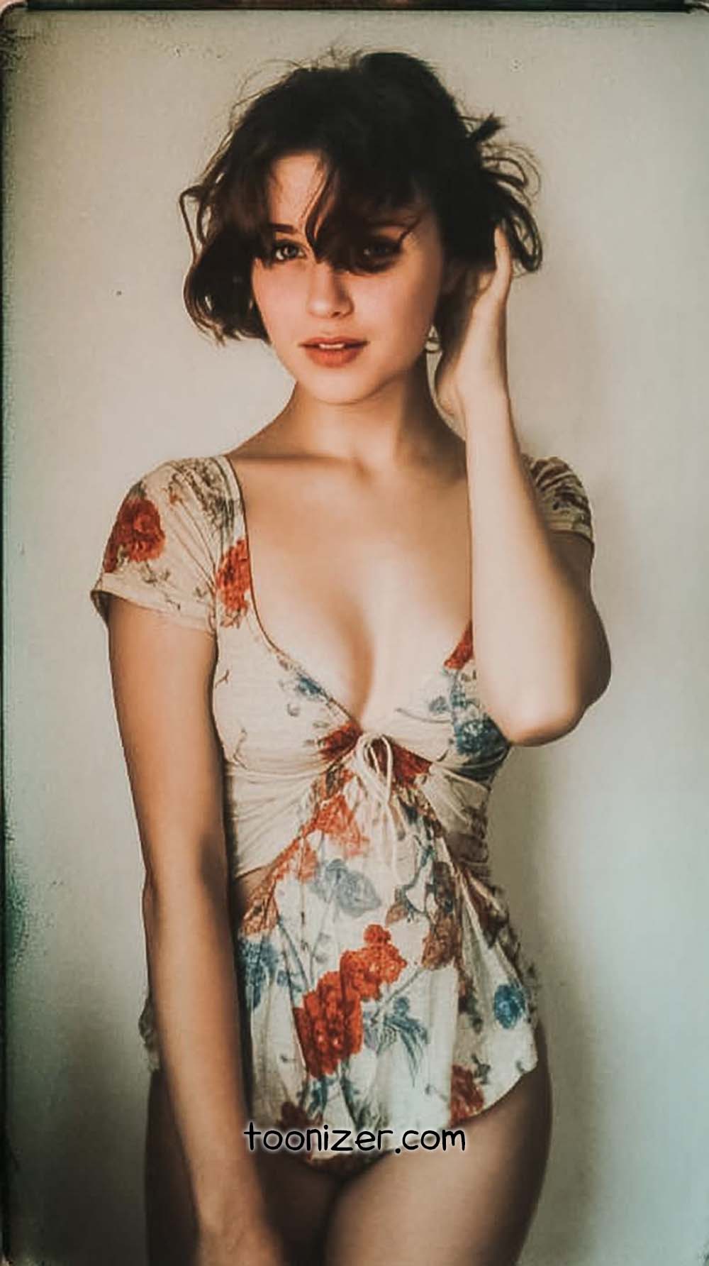 Person in floral dress posing indoors