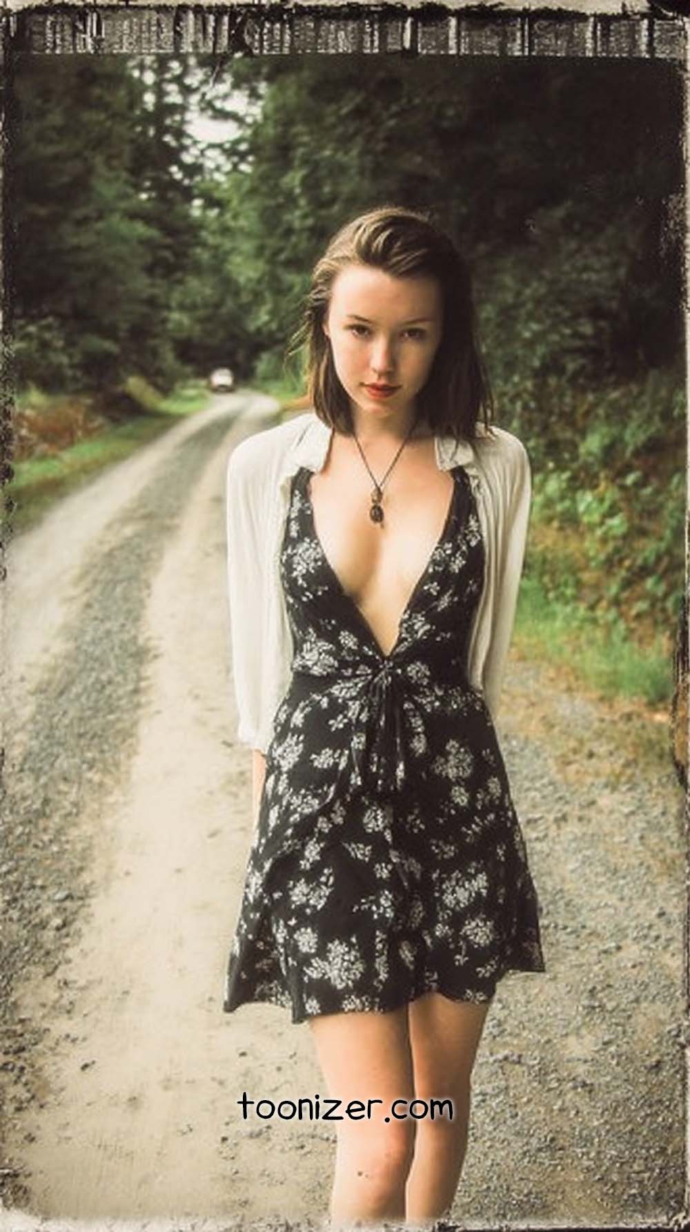 Person in floral dress on rural road