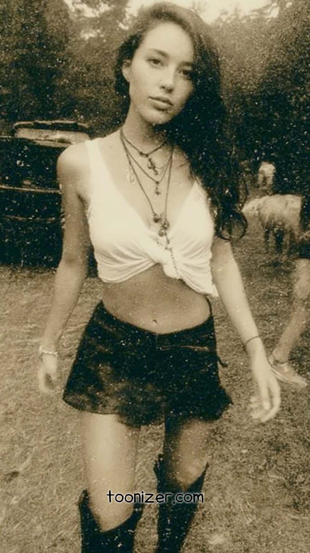 Vintage sepia photo of woman outdoors.