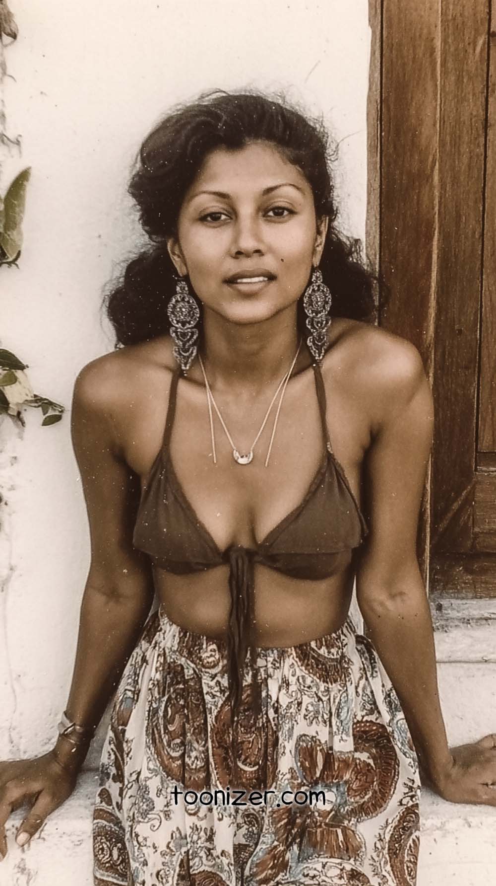Woman in boho attire posing outdoors