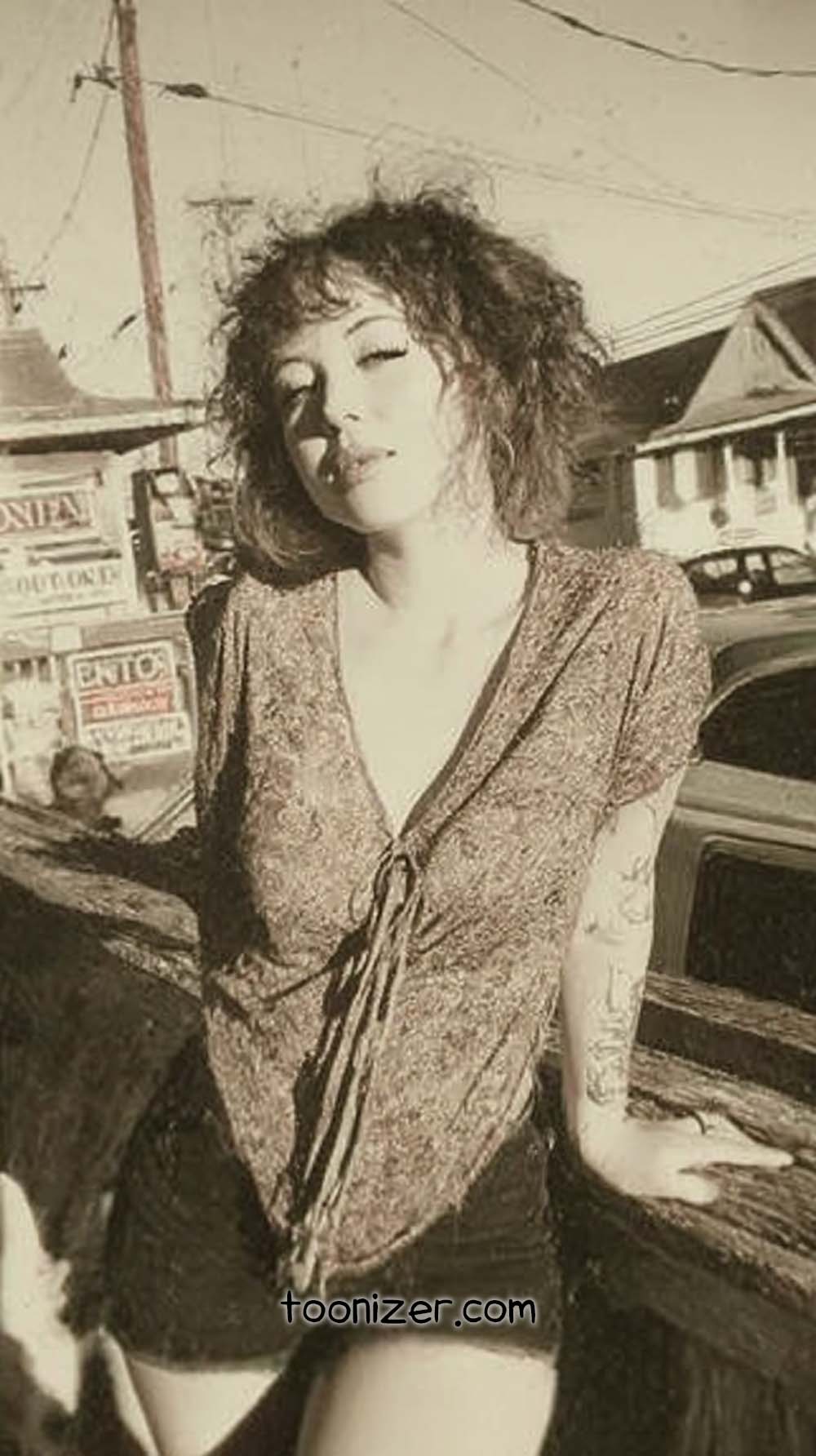 Vintage styled woman posing outdoors