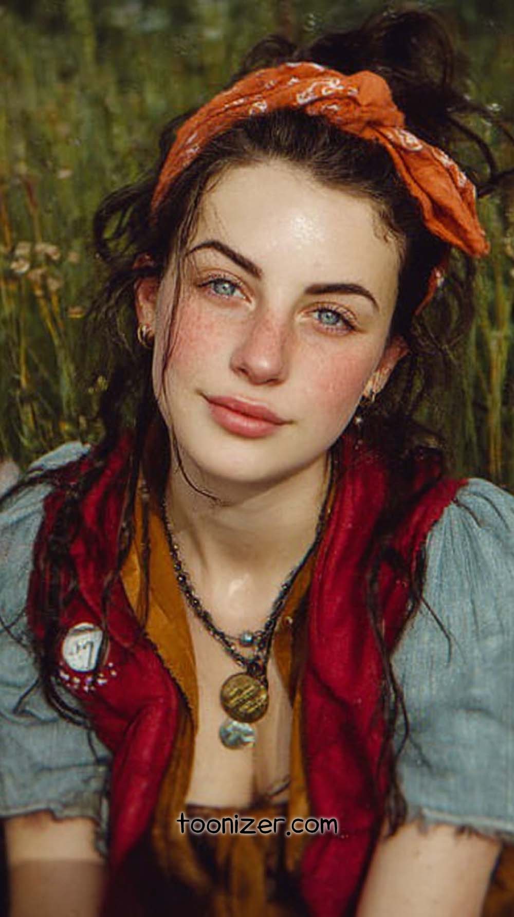 Woman with bandana outdoors in nature.