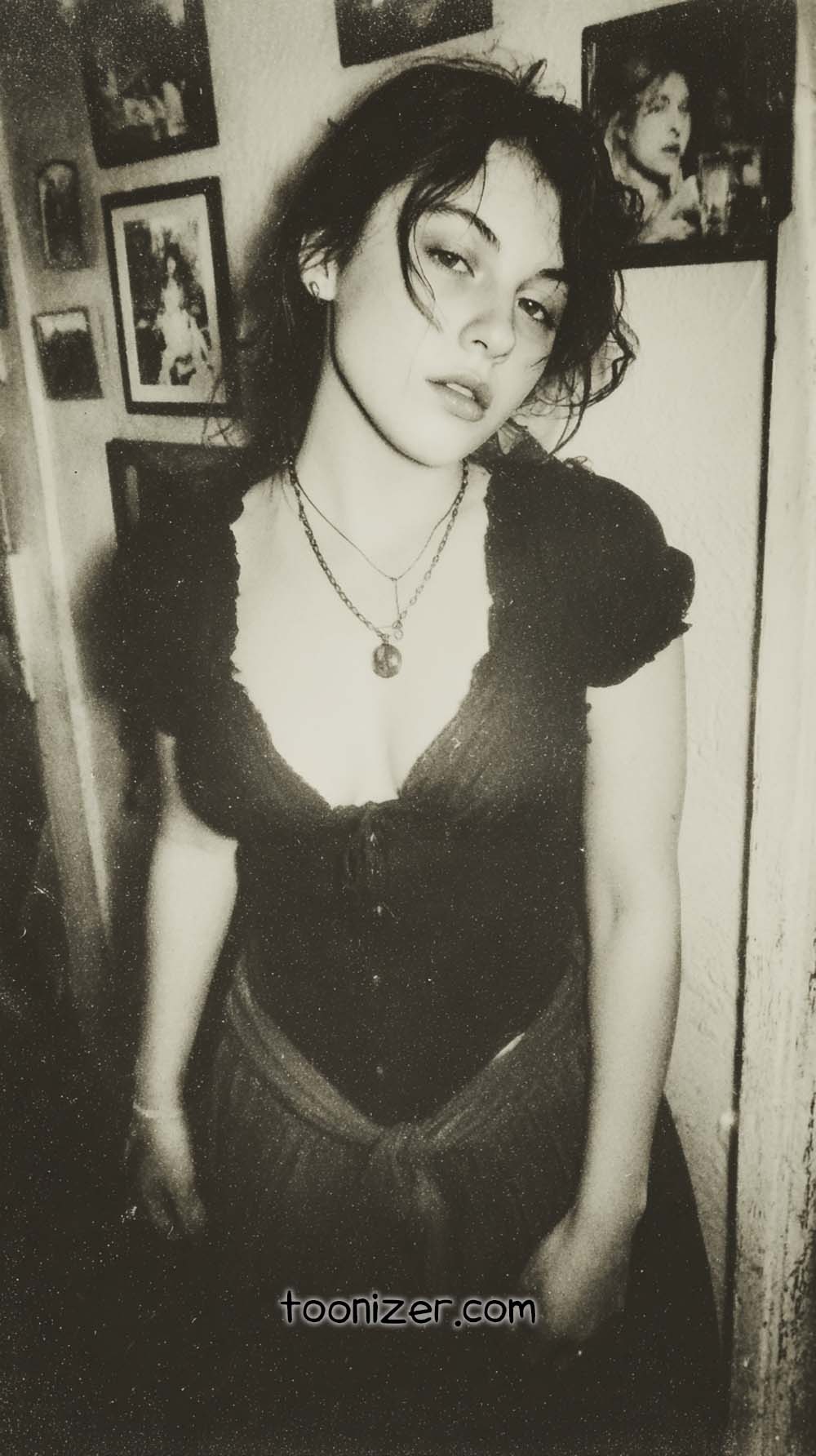 Black-and-white portrait of a woman indoors.