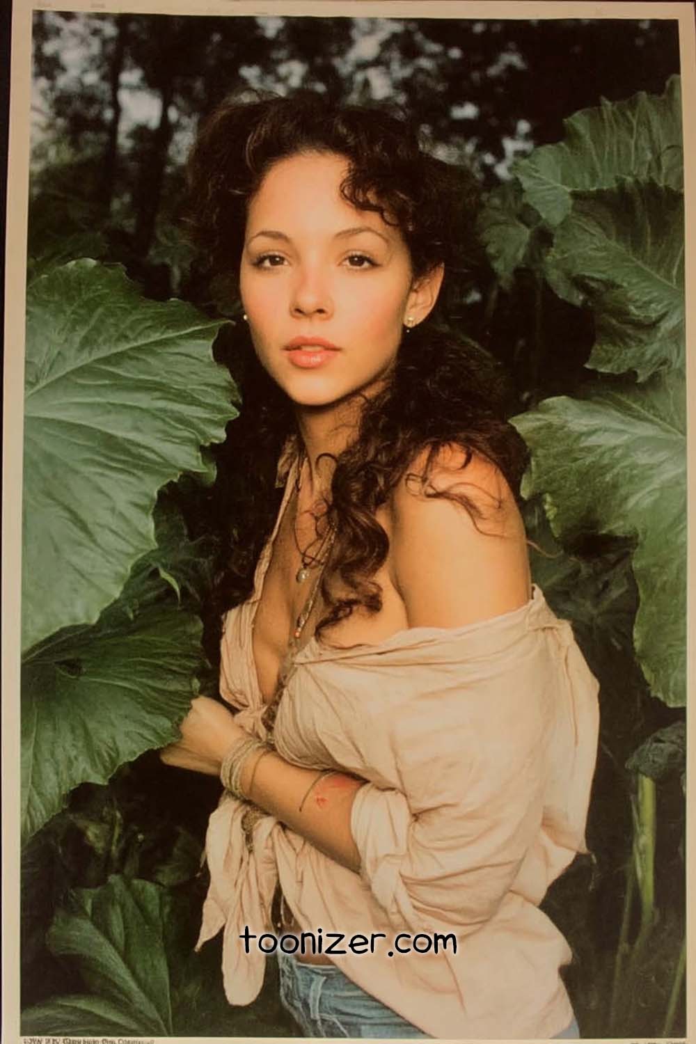 Woman in nature with large leaves backdrop