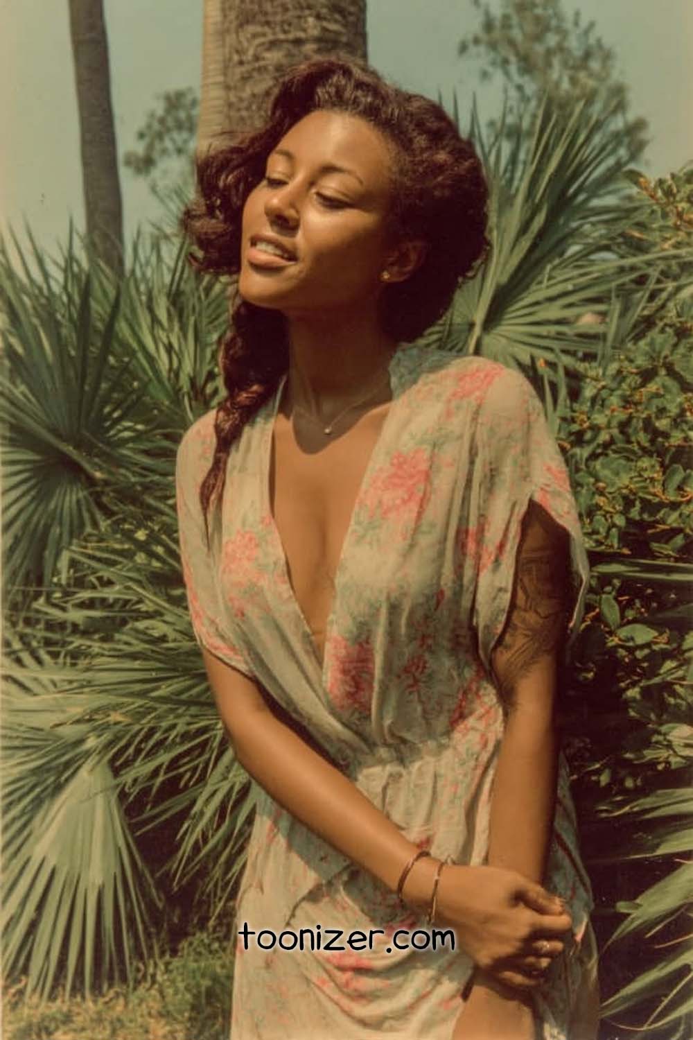 Woman enjoying sunny day in nature.