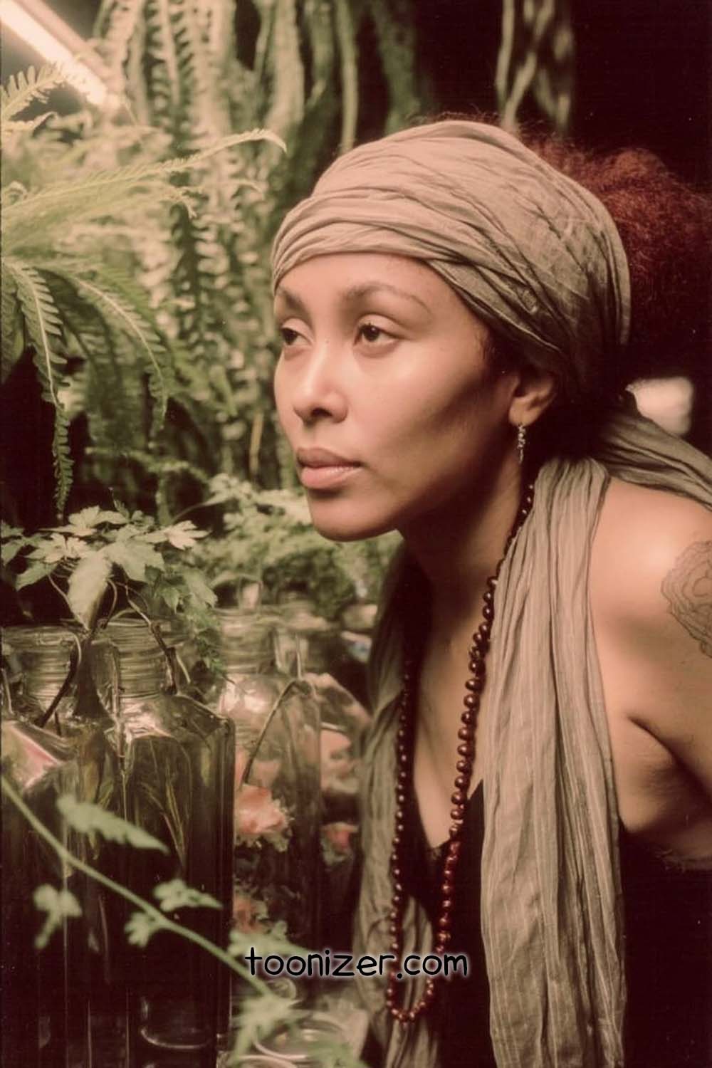 Person in garden with jars and greenery