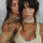 Two women wearing bohemian clothing, close-up portrait.